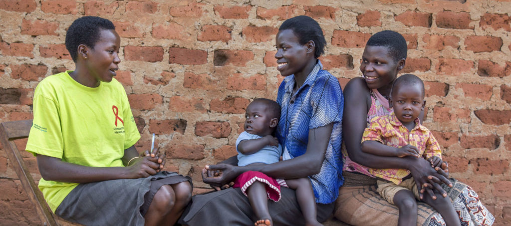 Community health worker | Community health worker Agnes Apid (L) with Betty Akello (R) and Caroline Akunu (center). Agnes is providing the women with counseling and family planning information | Jonathan Torgovnik/Getty Images/Images of Empowerment