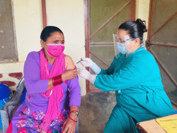 A health worker provides injectable contraception to a woman in Nepal