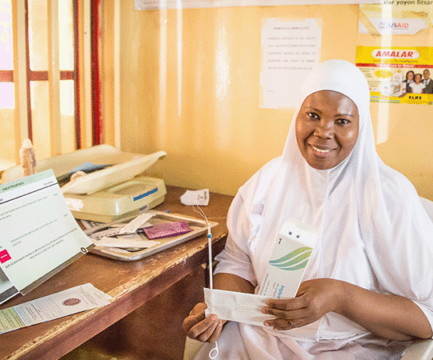 Nurse Holding insertion materials. This image is from "An Integrated Approach to Increasing Postpartum Long-Acting Reversible Contraception in Northern Nigeria” IBP Implementation Story by Clinton Health Access Initiative (CHAI).
