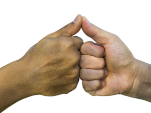Two hands meet in a fist bump with thumbs up.