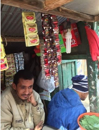 A man runs a nontraditional outlet in Nepal. 