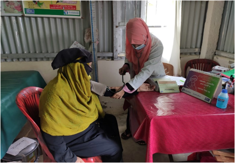A woman receiving SRHR services in a Health Post in Camp 22