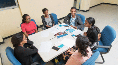 Several youth advocates in Ethiopia meet around a conference table to discuss their work related to adolescent and youth sexual and reproductive health.. Photo credit: Maheder Haileselassie Tadese/Getty Images/Images of Empowerment