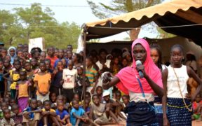 Performing a skit on early marriage, a girls’ team competes in a theater contest during the talent show portion of the Kolda Regional Fair, made possible by a Feed the Future grant. Photo by Lauren Seibert, Peace Corps, courtesy of Flickr