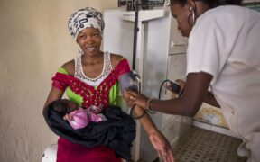 Women and their babies receiving post natal care at a health center in Senegal. Photo Credit: Images of Empowerment