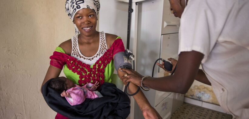 Women and their babies receiving post natal care at a health center in Senegal. Photo Credit: Images of Empowerment