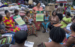 Informal workers gather for the meeting of their association at the market.