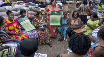 Informal workers gather for the meeting of their association at the market.